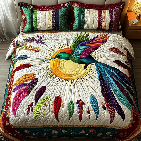 Feathered Grace quilted 3-piece bedding set on a made bed with two matching pillow shams