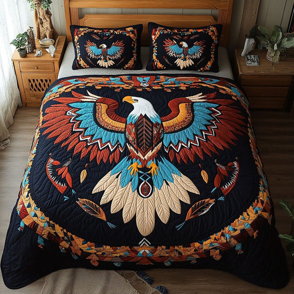 Feathered Guardian quilted 3-piece bedding set on a made bed with two matching pillow shams