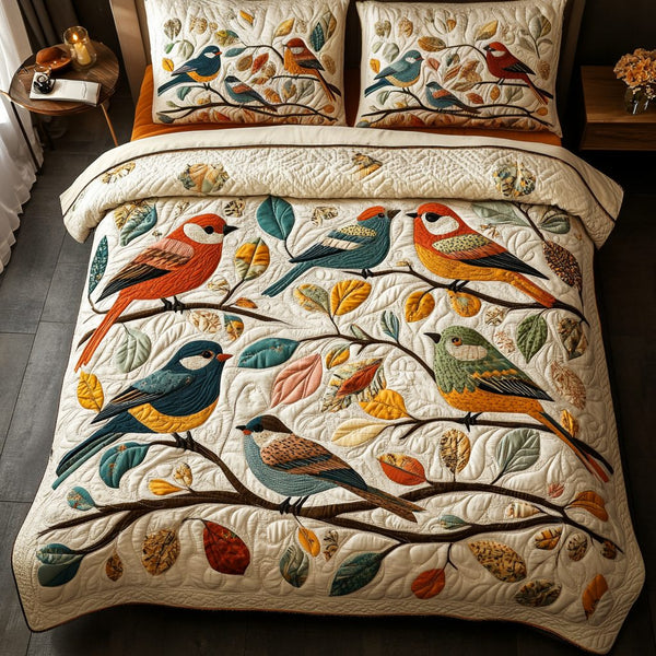 Feathered Harmony quilted 3-piece bedding set on a made bed with two matching pillow shams