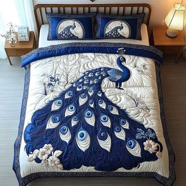 Feathered Jewel quilted 3-piece bedding set on a made bed with two matching pillow shams