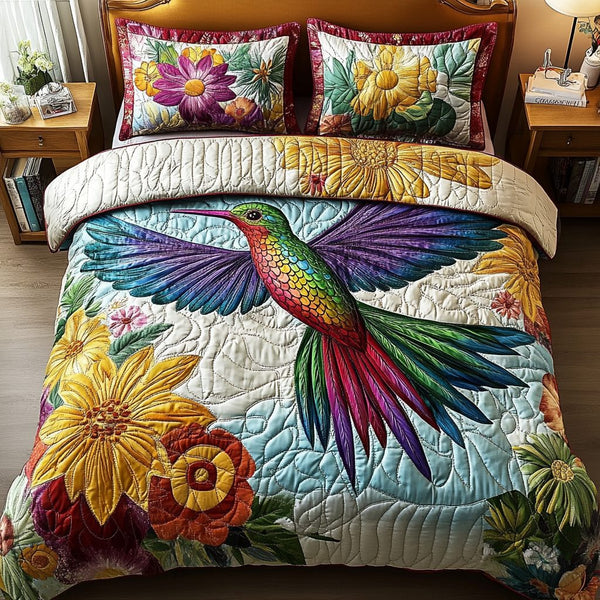 Feathered Majesty quilted 3-piece bedding set on a made bed with two matching pillow shams