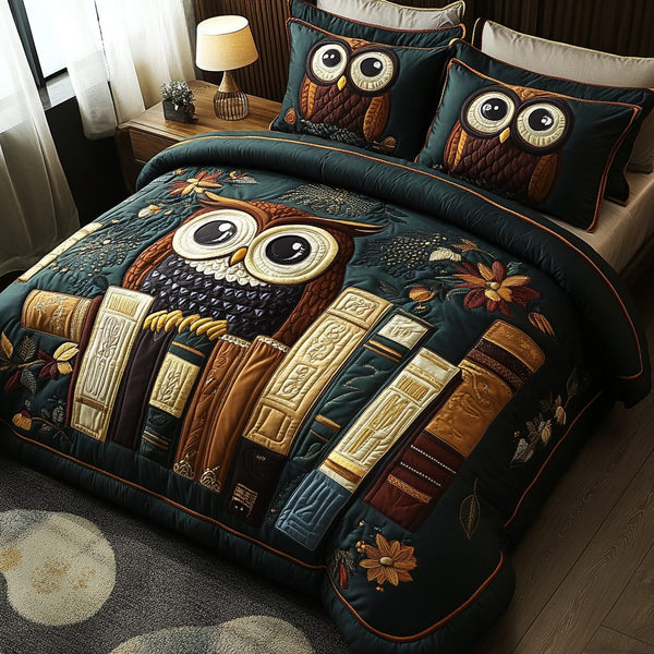 Feathered Scholar quilted 3-piece bedding set on a made bed with two matching pillow shams
