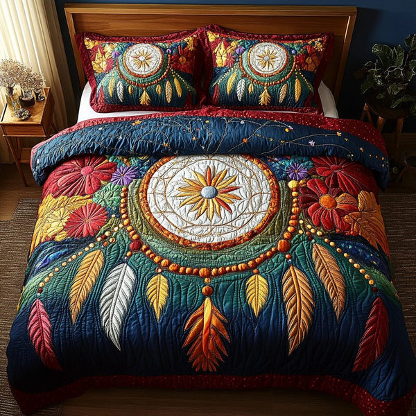 Feathered Serenity quilted 3-piece bedding set on a made bed with two matching pillow shams
