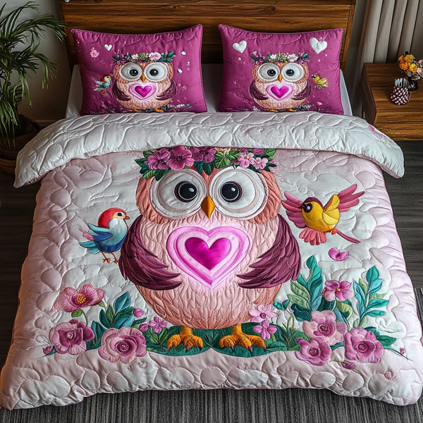 Feathered Soulmates quilted 3-piece bedding set on a made bed with two matching pillow shams