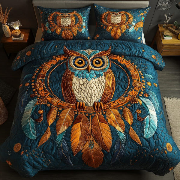 Feathered Spirit quilted 3-piece bedding set on a made bed with two matching pillow shams