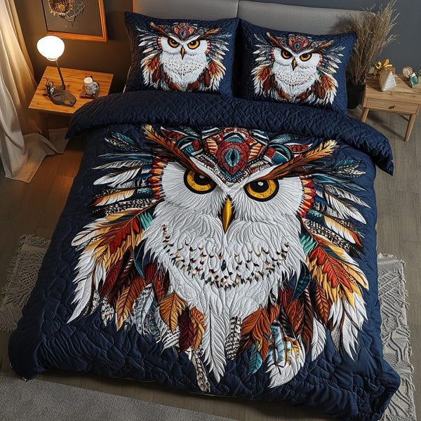 Feathered Spirit quilted 3-piece bedding set on a made bed with two matching pillow shams
