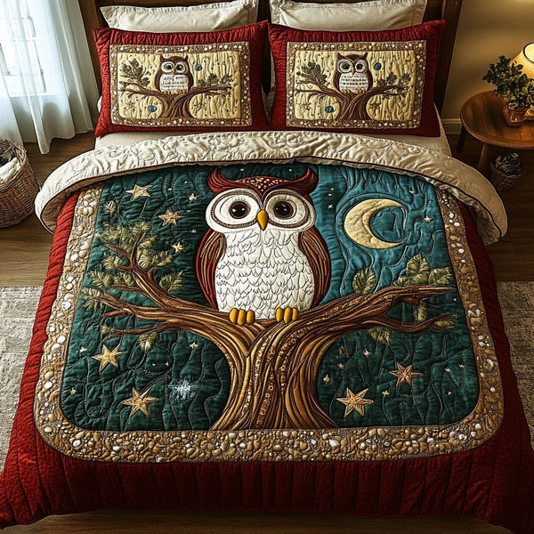 Feathered Wisdom quilted 3-piece bedding set on a made bed with two matching pillow shams