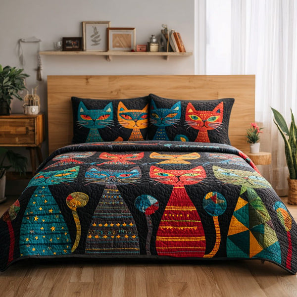 Feline Garden quilted 3-piece bedding set on a made bed with two matching pillow shams