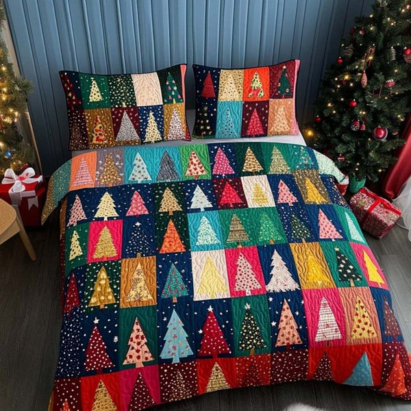 Festival of Trees quilted 3-piece bedding set on a made bed with two matching pillow shams