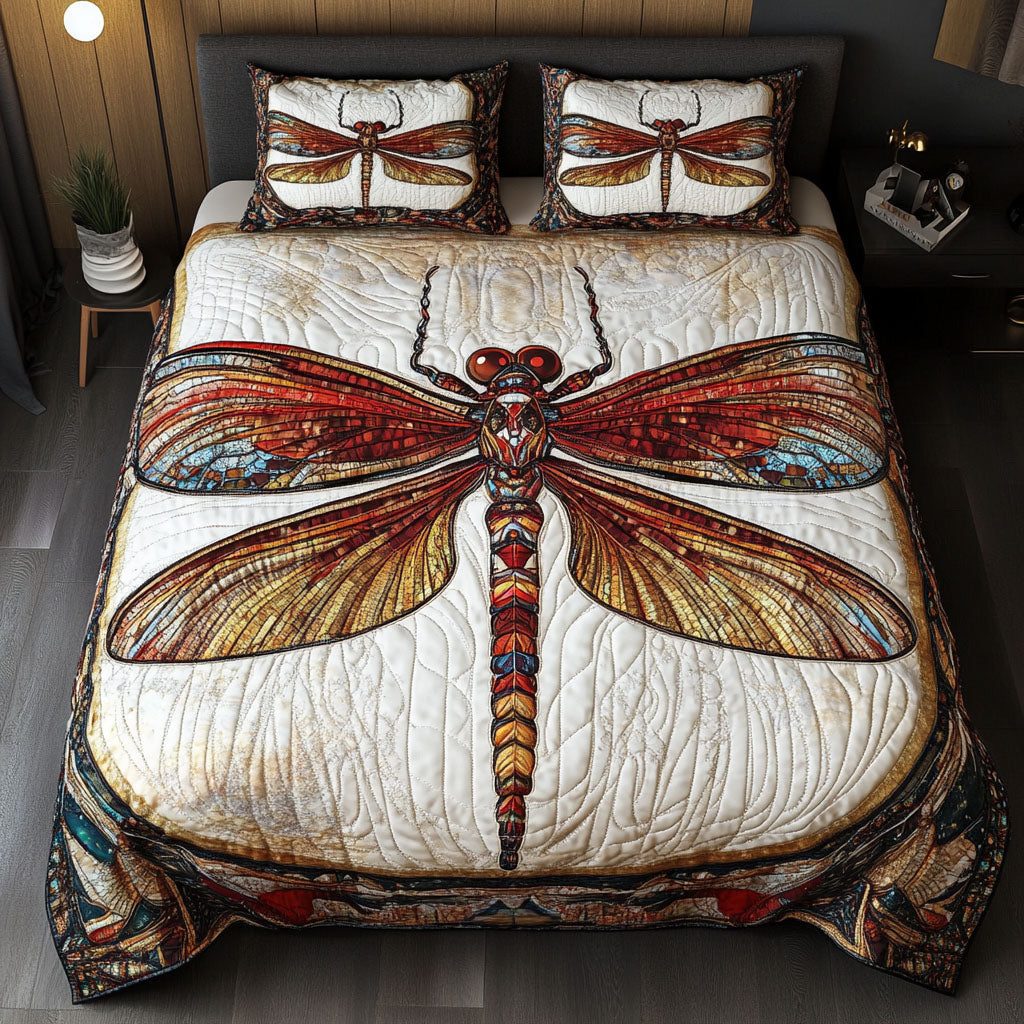 Fiery Mosaic Dragonfly quilted 3-piece bedding set on a made bed with two matching pillow shams