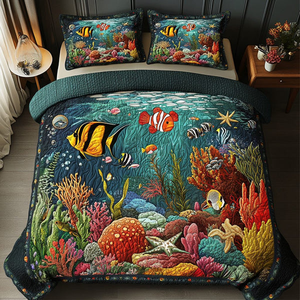 Fish Paradise quilted 3-piece bedding set on a made bed with two matching pillow shams