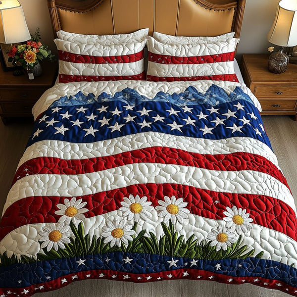 Flag and Flowers quilted 3-piece bedding set on a made bed in a warmly lit bedroom