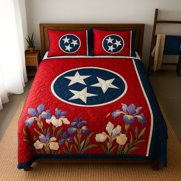 Flag of Flowers quilted 3-piece bedding set on a made bed in a warmly lit bedroom