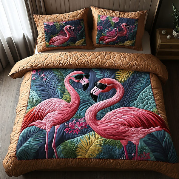Flamingo Bliss quilted 3-piece bedding set on a made bed with two matching pillow shams