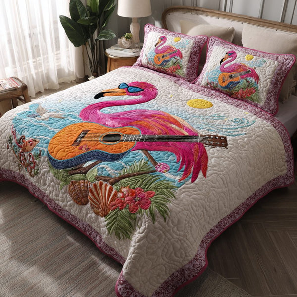 Flamingo Delight quilted 3-piece bedding set on a made bed with two matching pillow shams