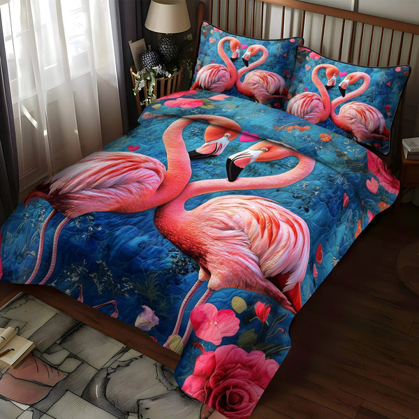Flamingo Fiesta quilted 3-piece bedding set on a made bed with two matching pillow shams