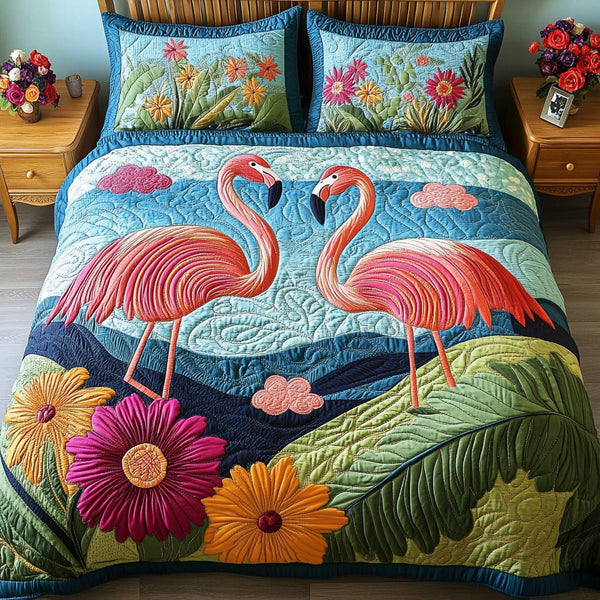 Flamingo Flock quilted 3-piece bedding set on a made bed with two matching pillow shams