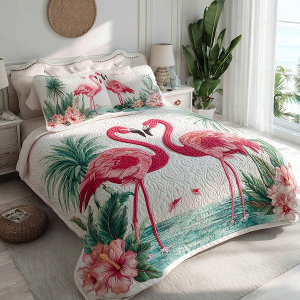 Flamingo Love quilted 3-piece bedding set on a made bed with two matching pillow shams