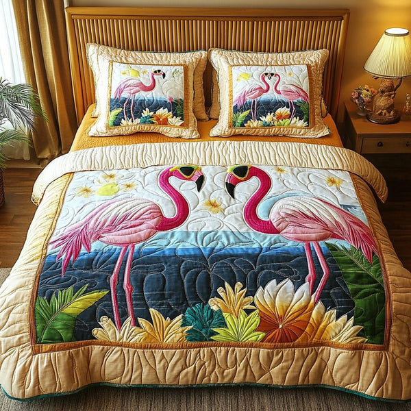 Flamingo Sunset quilted 3-piece bedding set on a made bed with two matching pillow shams