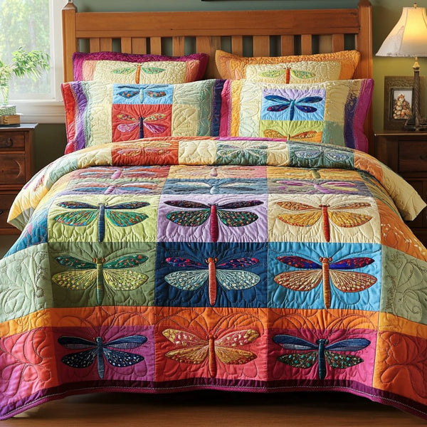 Flight of Dreams quilted 3-piece bedding set on a made bed with two matching pillow shams
