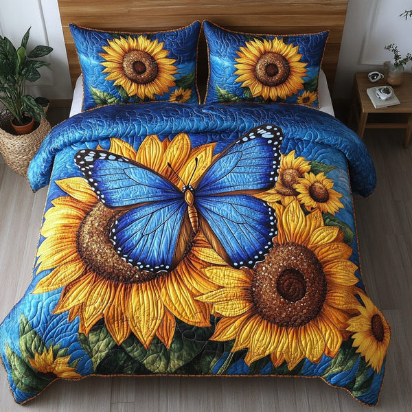 Flight of Fantasy quilted 3-piece bedding set on a made bed with two matching pillow shams