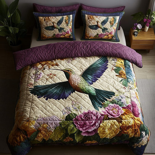 Flight of Grace quilted 3-piece bedding set on a made bed with two matching pillow shams