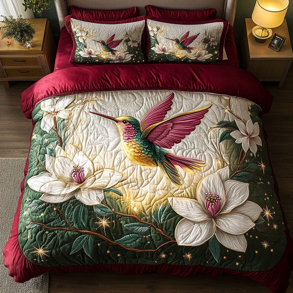 Flight of Joy quilted 3-piece bedding set on a made bed with two matching pillow shams