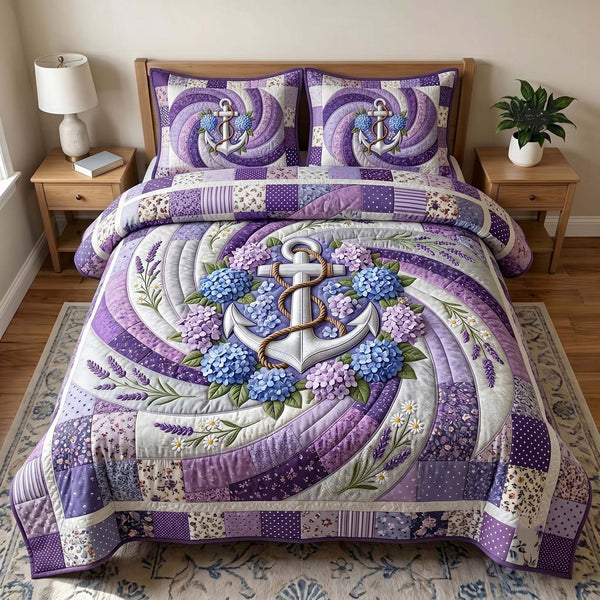 Floral Anchor quilted 3-piece bedding set on a made bed in a light coastal bedroom