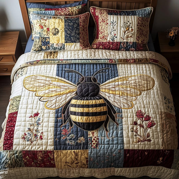 Floral Bee Bliss quilted 3-piece bedding set on a made bed with two matching pillow shams