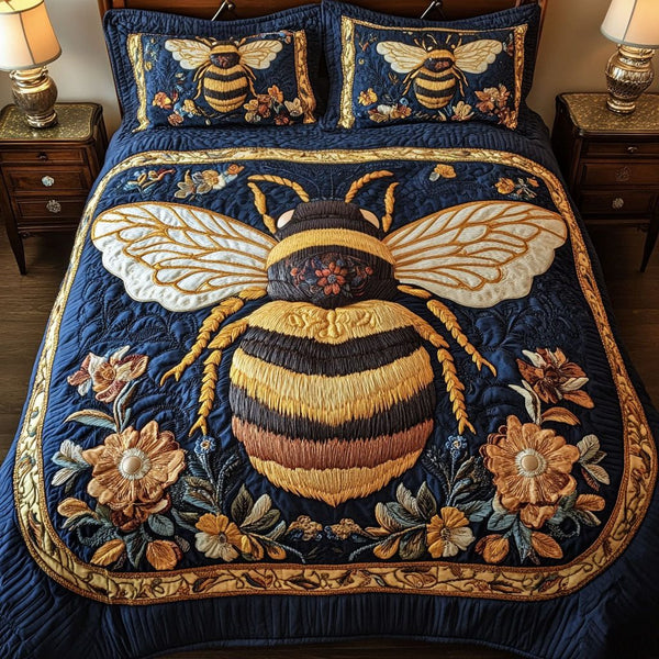 Floral Bee Charm quilted 3-piece bedding set on a made bed with two matching pillow shams