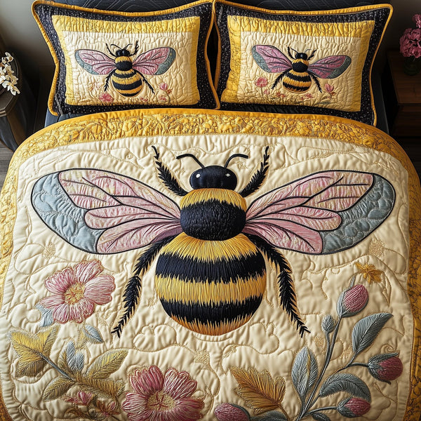 Floral Bee quilted 3-piece bedding set on a made bed with two matching pillow shams