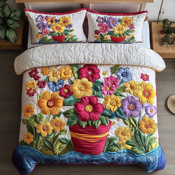 Floral Bliss quilted 3-piece bedding set on a made bed with two matching pillow shams