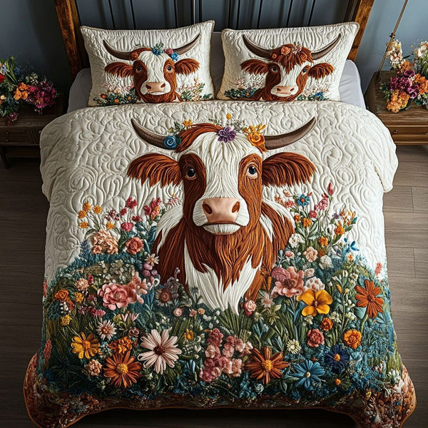 Floral Cow Dreamscape quilted 3-piece bedding set on a made bed with two matching pillow shams