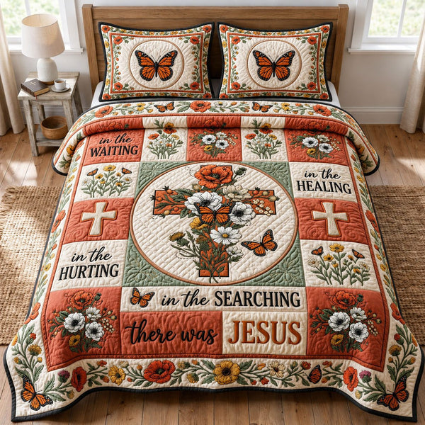 Floral Cross quilted 3-piece bedding set on a made bed in a softly lit bedroom