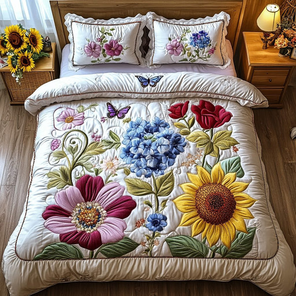 Floral Dreamscape quilted 3-piece bedding set on a made bed with two matching pillow shams