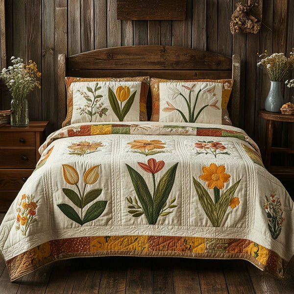 Floral Elegance quilted 3-piece bedding set on a made bed with two matching pillow shams