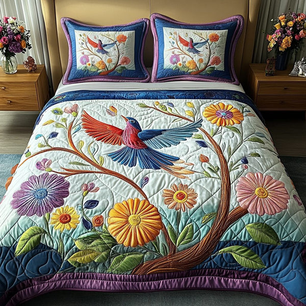 Floral Essence quilted 3-piece bedding set on a made bed with two matching pillow shams