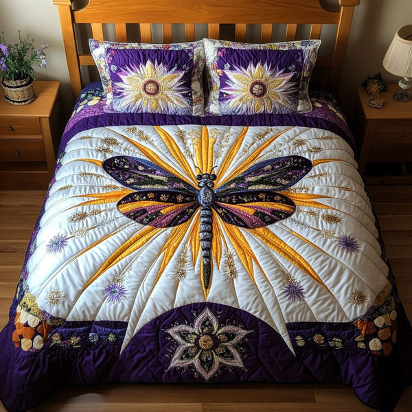 Floral Flight Dreams quilted 3-piece bedding set on a made bed with two matching pillow shams