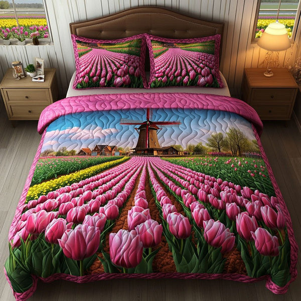 Floral Flight Parade quilted 3-piece bedding set on a made bed with two matching pillow shams