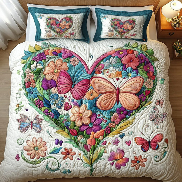 Floral Flight quilted 3-piece bedding set on a made bed with two matching pillow shams