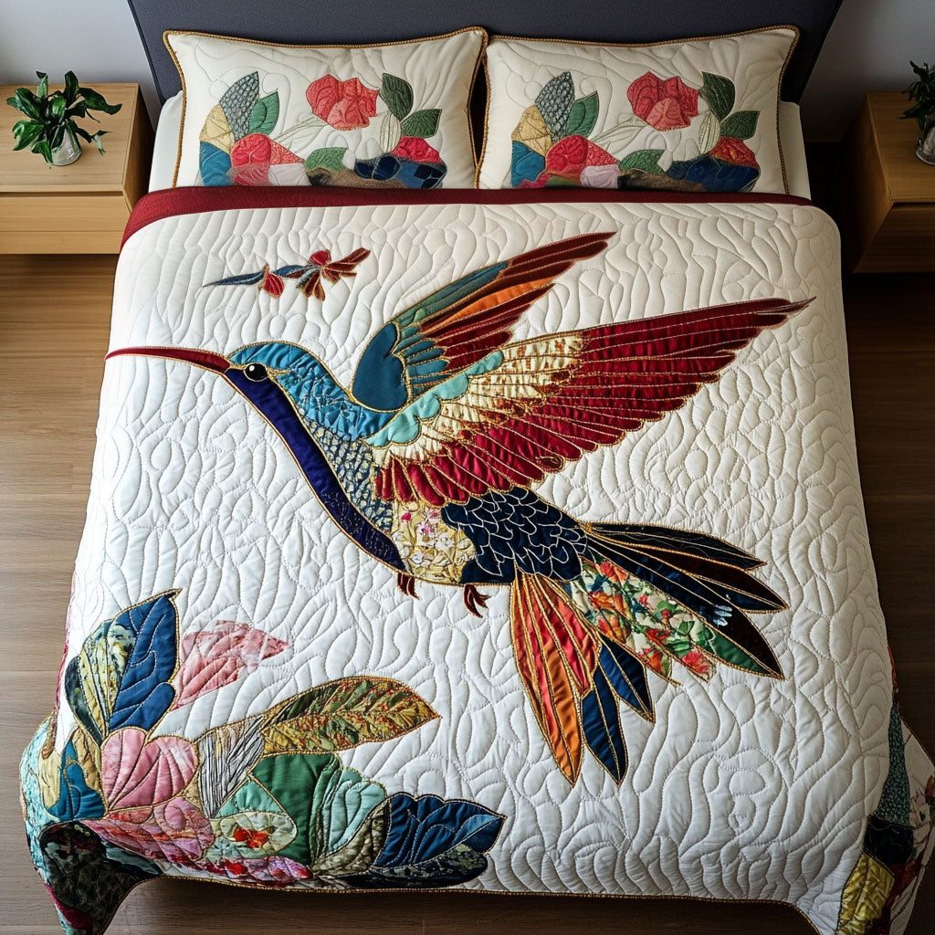Floral Flight quilted 3-piece bedding set on a made bed with two matching pillow shams