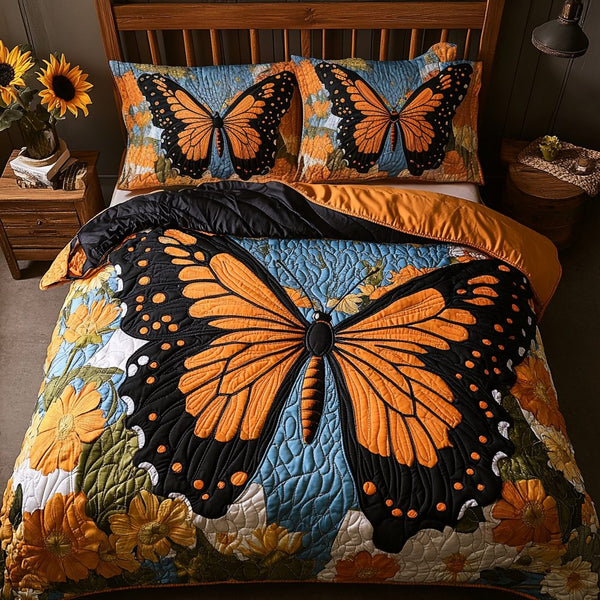 Floral Flight quilted 3-piece bedding set on a made bed with two matching pillow shams