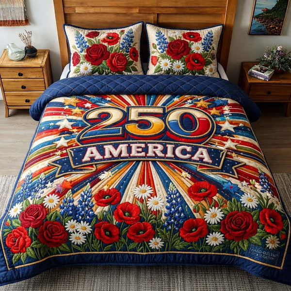 Floral Freedom quilted 3-piece bedding set on a made bed in a warmly lit bedroom