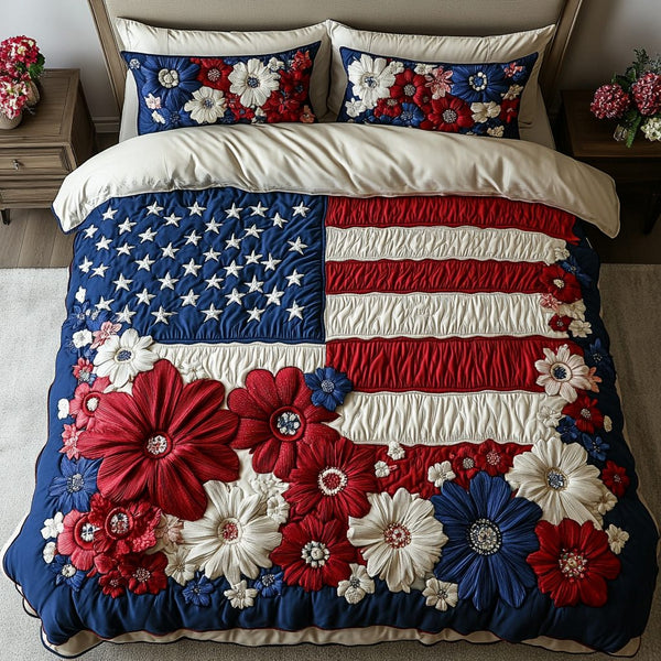 Floral Glory quilted 3-piece bedding set on a made bed with two matching pillow shams