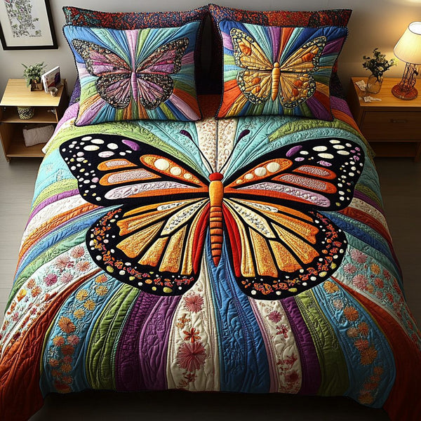 Floral Glow quilted 3-piece bedding set on a made bed with two matching pillow shams