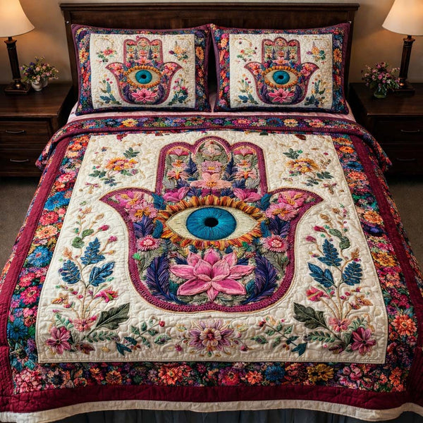 Floral Hamsa Harmony quilted 3-piece bedding set on a made bed with two matching pillow shams