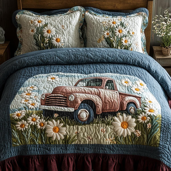 Floral Haul quilted 3-piece bedding set on a made bed with two matching pillow shams