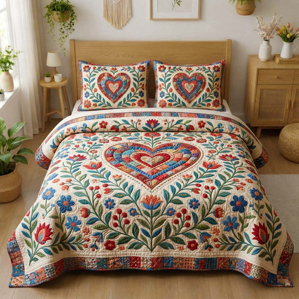 Floral Heart quilted 3-piece bedding set on a made bed with two matching pillow shams