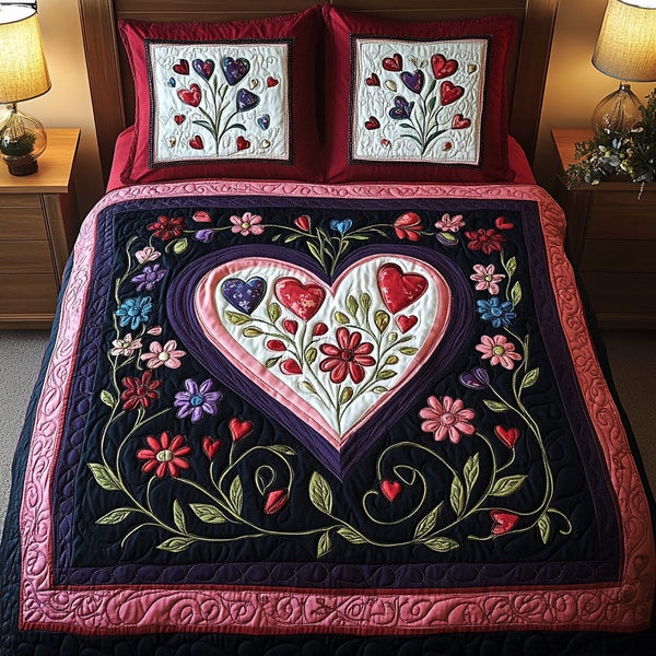 Floral Heartburst quilted 3-piece bedding set on a made bed with two matching pillow shams