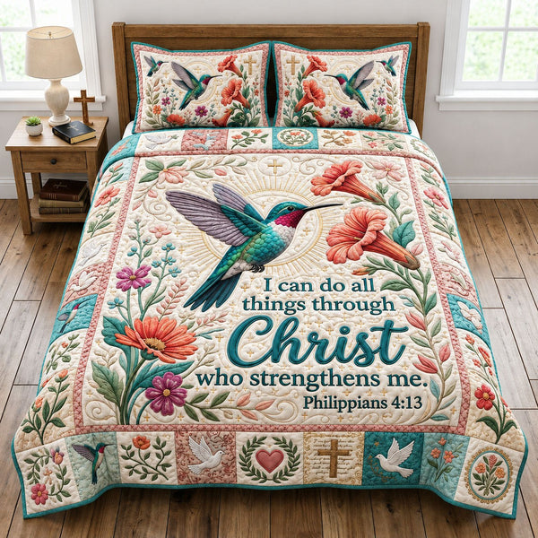 Floral Hummingbird quilted 3-piece bedding set on a made bed with two matching pillow shams